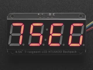 Red 7-segment clock display soldered to backpack with all segments lit