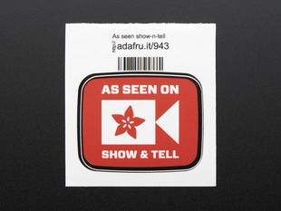 This is the As seen on show & Tell 
Square sticker displaying the Adafruit flower logo as a camcorder  